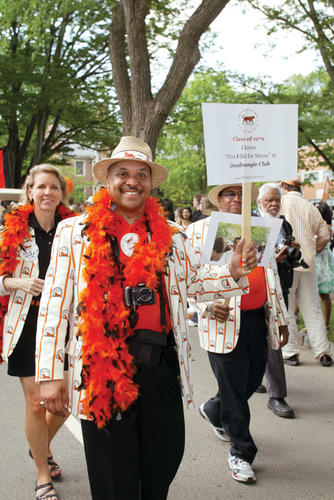 Gary M. King ’79, center, and Wendy Weisend Kuran ’79 and Prentis Hall ’79 show their stripes as they march in the P-rade accompanied by music of the 1970s.