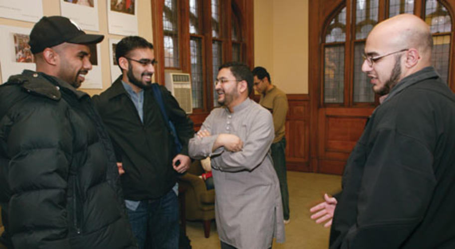 Chaplain Sohaib Sultan, third from left, talks with students after the weekly prayer service, which is held in a room in Murray-Dodge Hall that is set aside for Muslim prayer.