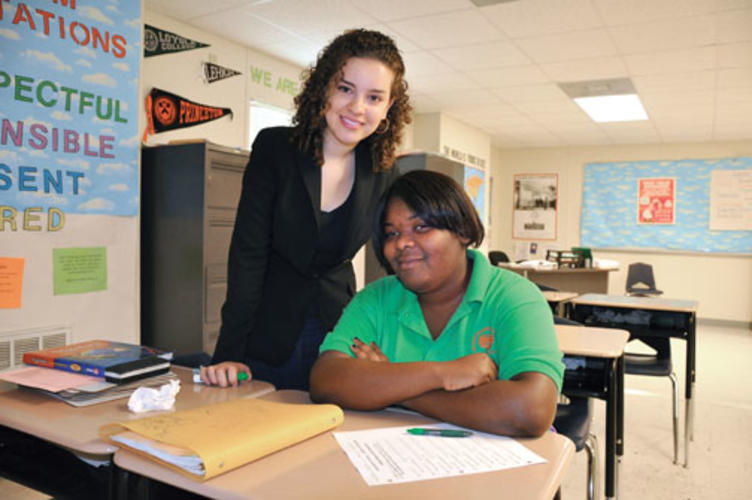 Jeylan Erman ’08, left, with a student at Carver High School in New Orleans.