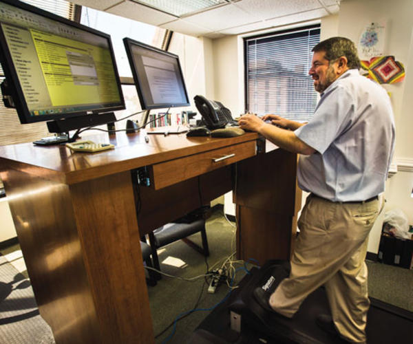Mark Mellman ’78 sometimes works while walking on a treadmill. A colleague explains: “Mark can’t always get to the gym, so we brought the gym to him.”