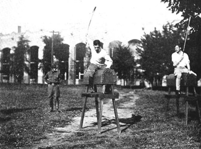 Students hone their technique as polo coach Maj. F.B. Prickett watches, in this photo believed to be from the late 1920s.