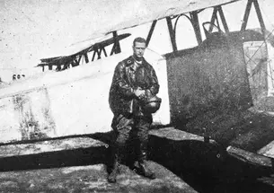 Hobey Baker as a Flight Commander in France stands by his plane. 
