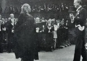 Toni Morrison receives her Nobel Prize from the King of Sweden and acknowledges the applause of the crowd.