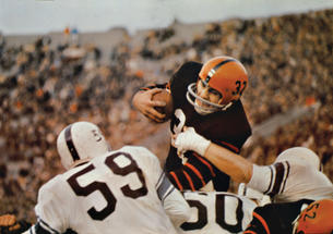 Fullback Cosmo Iacavazzi ’65 *68 carrying the ball 