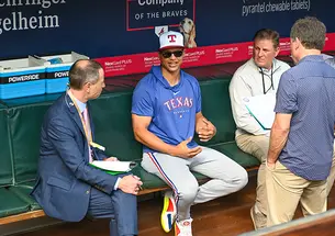 Will Venable sits in baseball dugout and speaks with reporters