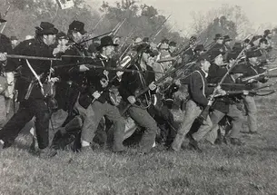 An estimated 40,000 Americans take part in reenactments of Civil War battles, like this one last October at Spring Hill, Tennessee. 