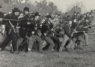 An estimated 40,000 Americans take part in reenactments of Civil War battles, like this one last October at Spring Hill, Tennessee. 