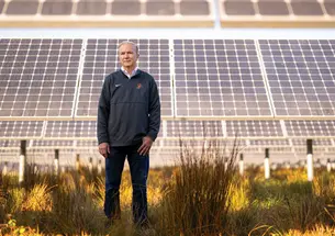 Tom Leyden ’77 at a University solar farm