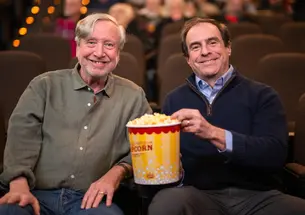 Professor Sean Wilentz and Princeton Alumni Weekly senior writer Mark. F. Bernstein ’83 sharing a tub of popcorn at the Garden Theater.