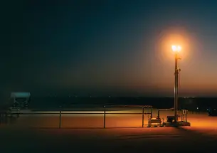An oil well photographed at sunset.