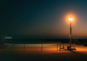 An oil well photographed at sunset.