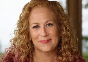 Author Jodi Picoult sitting on her back porch
