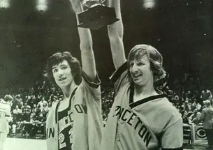 Tim van Blommesteyn, left, and Brien O'Neill lift the NIT trophy in 1975