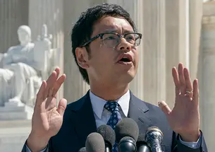 Dale Ho ’99 speaks to reporters after he argued before the Supreme Court against the Trump administration’s plan to ask about citizenship on the 2020 census in 2019. 