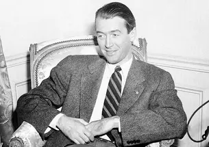 Screen star Jimmy Stewart ’32 relaxes in his suite at the Waldorf-Astoria in New York on Jan. 11, 1946. 