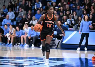 Fadima Tall dribbles near the center of the court against Columbia