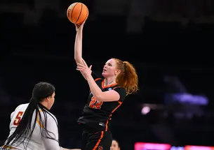 Parker Hill shoots with her right hand over defender Audi Crooks