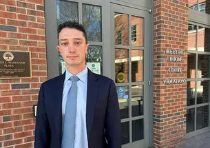 David Piegaro ’25 stands in front of Municipal Court.