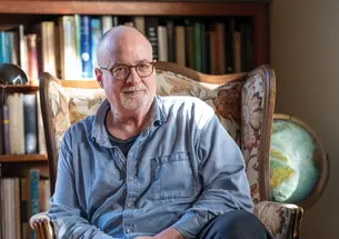 Christian Crumlish ’86 with a bookshelf in the background.