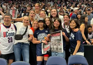 Kaitlyn Chen ’24, center, celebrates Connecticut’s national championship with family and friends, including Princeton head coach Carla Berube.