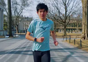 Kanato Goto, a former postdoctoral researcher in the University’s physics department runs on campis past Whi and Clio Halls