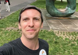 P.G. Sittenfeld ’07 takes a selfie in front of the Oval with Points sculpture at Reunions in 2022.