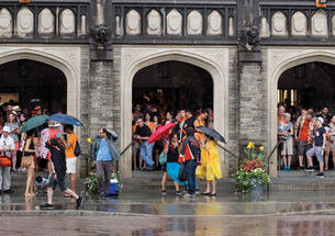 Reuners standing under the portico at Firestone Lirary to escape the rain during the 2018 P-rade