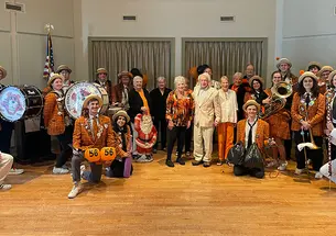 Band members and residents pose at a retirement community in New Jersey