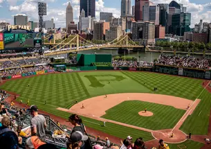 Areal view of PNC Park where the field is in the center and the city buildings are visible in the background.