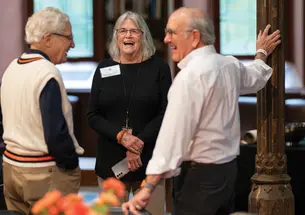 Dottie Werner speaking with two members of the Old Guard