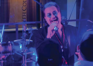 Anthony Russo performing as Bono from U2