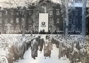 A black-and-white photo of commencement in front of Nassau Hall.