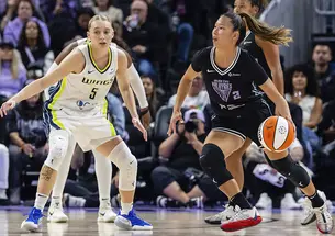 Kaitlyn Chen dribbles against former UConn teammate Paige Bueckers