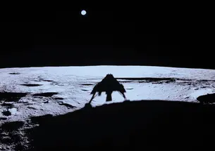 Blue Ghost casts a shadow across the moon after landing on the surface