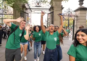 Freshmen from Rockefeller College celebrate the Class of 2029 Pre-rade, flanked by an audience of students, alumni, faculty, and staff.