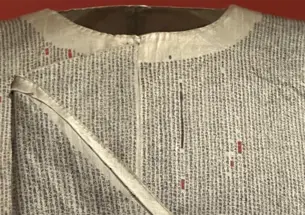 Items on display include the Pulinsidun daxue baguwen sichou chenyi (The Princeton eight-legged essays silk shirt), a 19th-century Chinese garment with more than a half million miniature characters. 