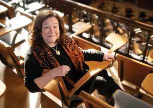 Cressey Belden ’91 sits at a desk in McCosh 50.
