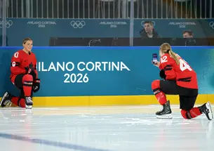 Claire Thompson ’20, right, snaps a photo of Canada teammate Sarah Fillier at the Olympic hockey rink