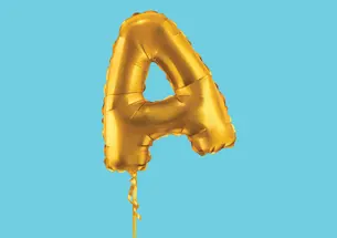 an inflated golden ballon in the shape of the letter A on a blue background