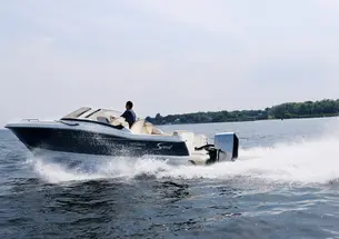 a boat using a Flux Marine motor speeding through the water