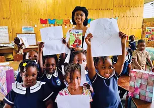 Sophia Steele ’23 visits students at the Chester Castle Primary School in Hanover, a school supported by the residency.