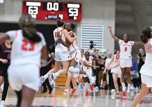 The women’s basketball team celebrates after beating Harvard to win Ivy Madness and advance to the NCAA Tournament.