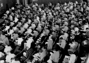 Students take an exam in McCosh 50