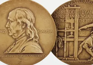 Pulitzer Prize gold medal front and back