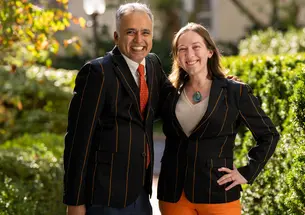 Karthick Ramakrishnan *02 and Natalie Berkman *18 model the new APGA blazer.