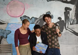 From left, Tanaka Dunbar Ngwara ’24, student Queen Sibanda, and Dominic Dominquez ’25 celebrate Sibanda's award.