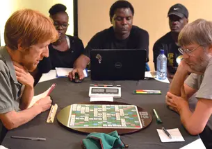 Adam Logan &rsquo;95, left, began playing Scrabble at an early age and entered his first tournament around age 10. Since then, he&rsquo;s played around 2,700 games. 