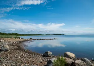 Rocky shoreline of the crystal blue Baltic Sea. 