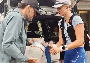 Sam Smart refills her water during her ultramarathon run on California&rsquo;s Dipsea Trail.