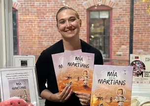 TOW_EmmaLouden20_web2.jpg Emma Louden holds copies of her children's book, Mia and the Martians.